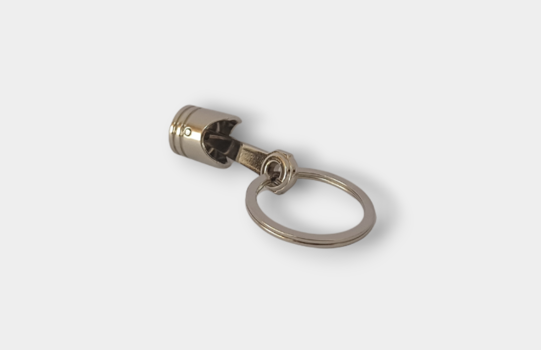 Breloc Piston